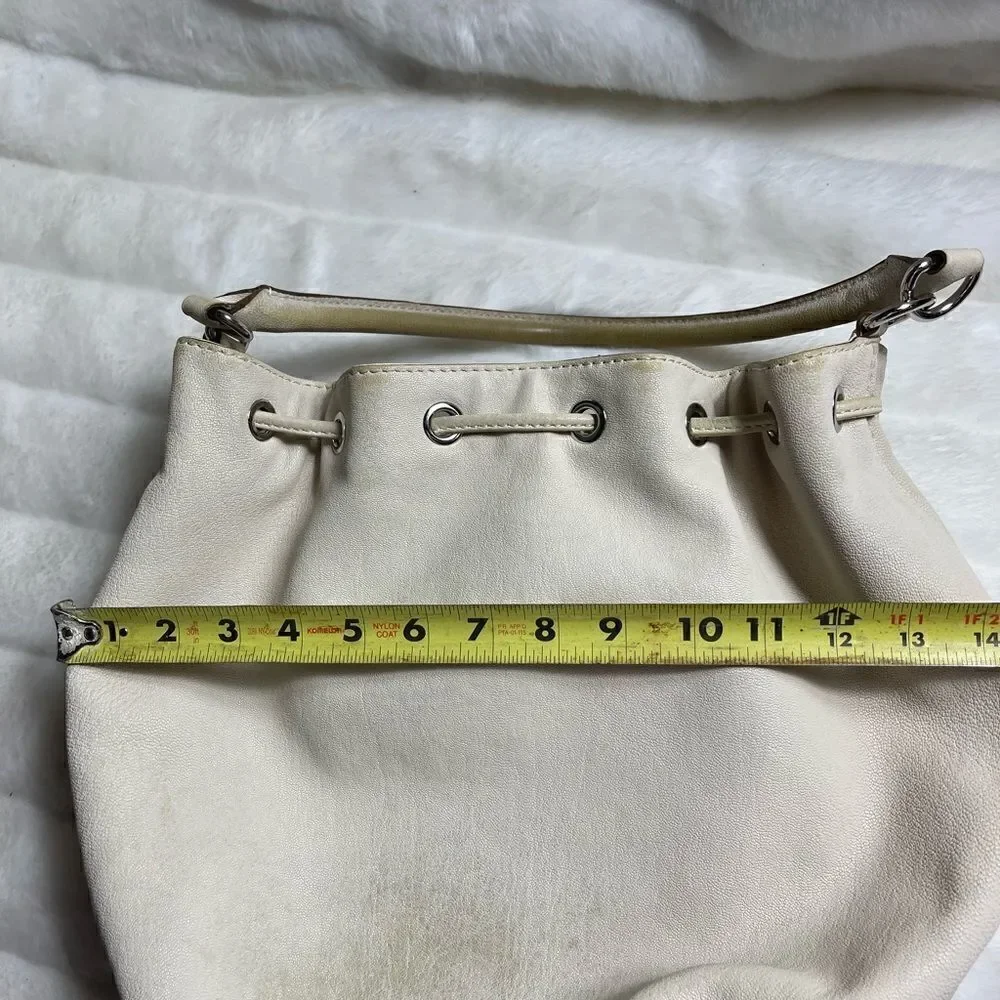 Michael Michael Kors leather beige drawstring bucket satchel.silver tone accents